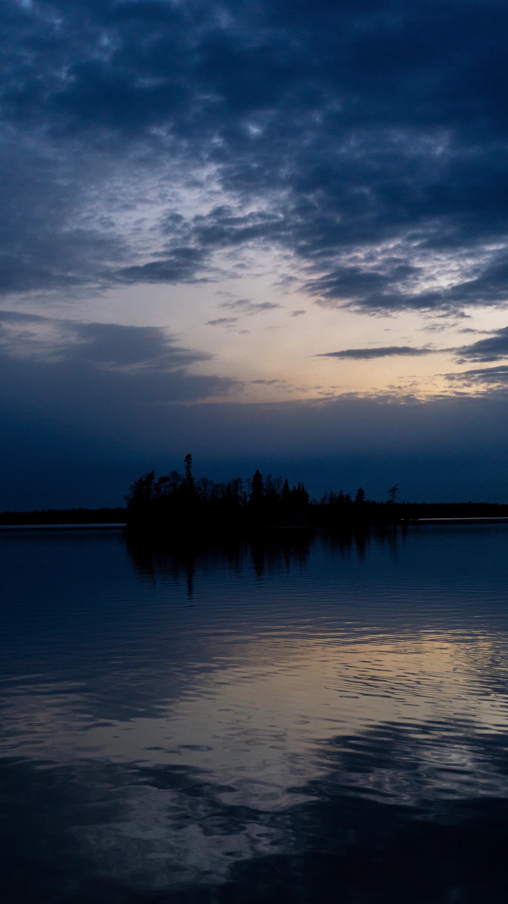 A landscape reflected in still water.